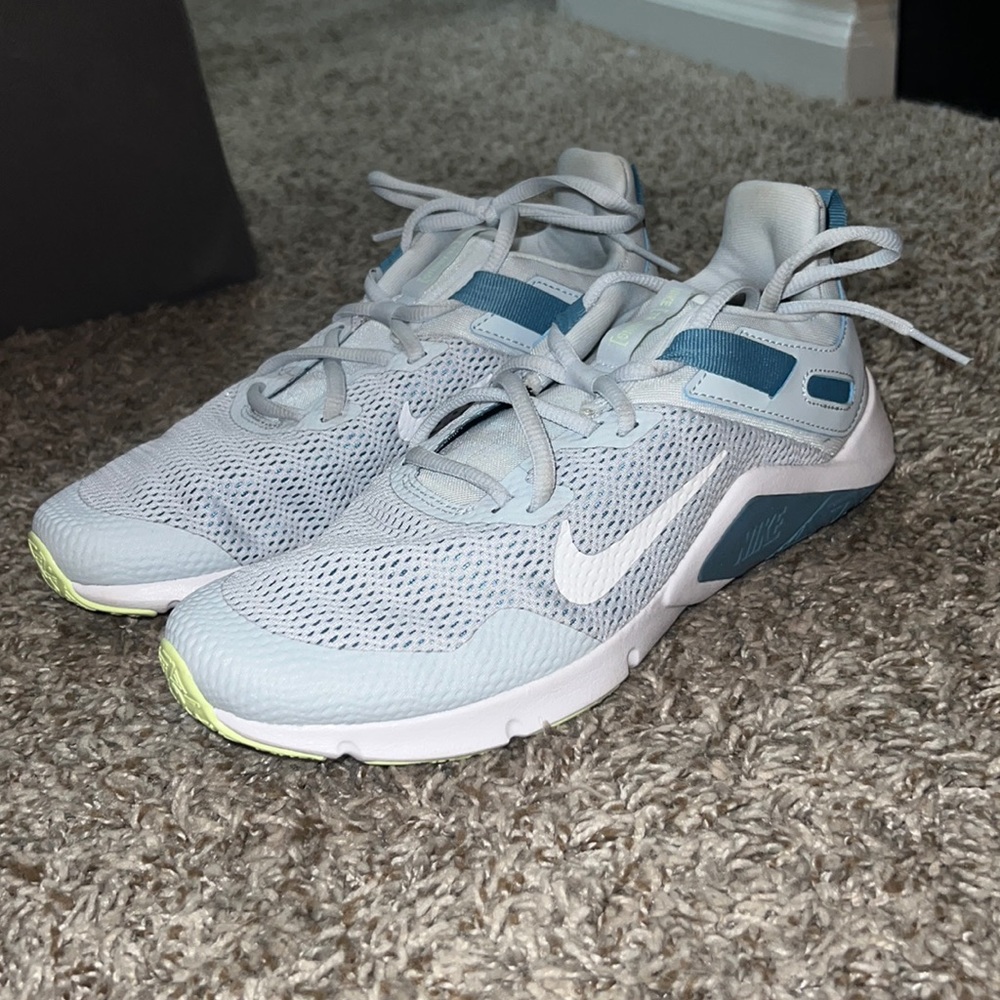 Brand new Nike running shoes. size nine, light blue and light green!